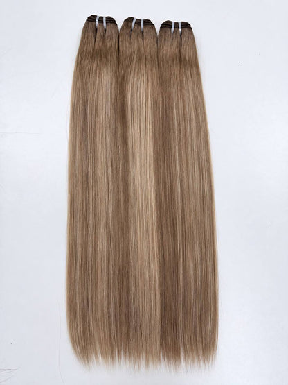 Straight hair bundle set in champagne blonde with subtle warm highlights