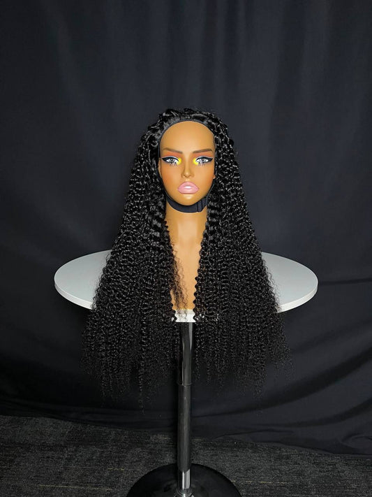 Black kinky curly half wig with full coverage center part on a mannequin head