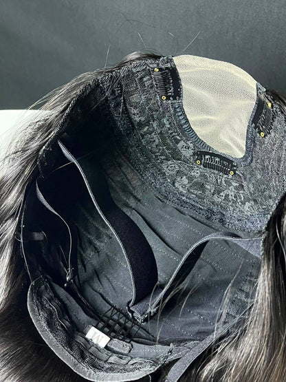 Dark U-part wig with adjustable straps and beige mesh cap, shown from inside