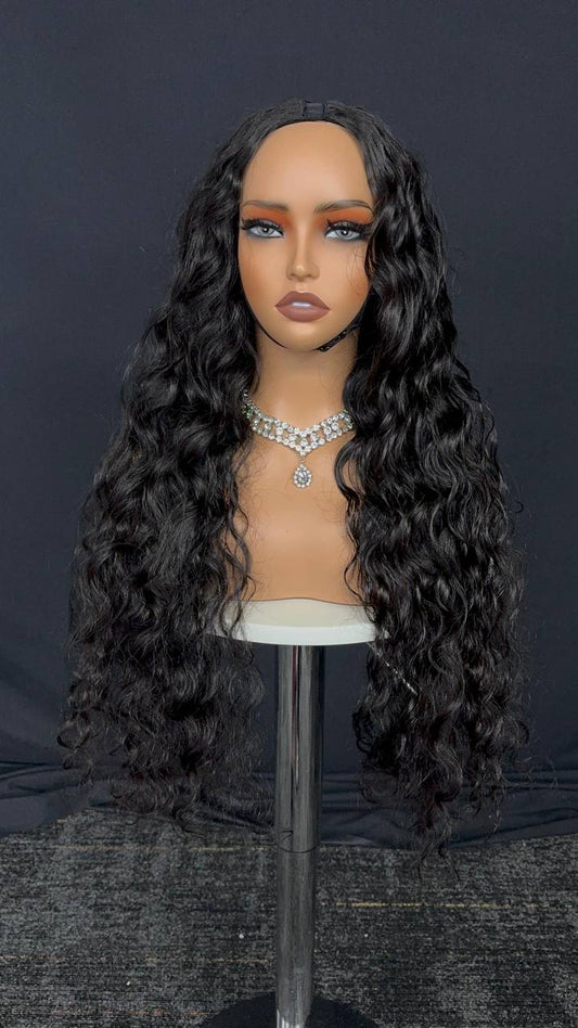 Dark curly U-part wig on mannequin with straightened hairline section