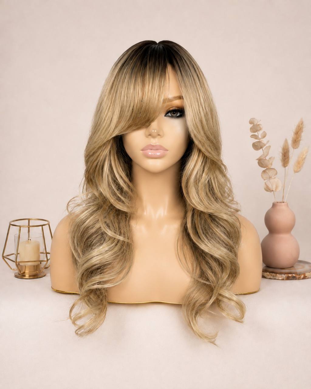 Synthetic lace wig with honey-blonde layered curls and side-swept bangs