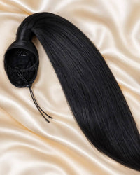 Black straight ponytail hair extension with attached cap and matching securing cord