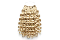 Curly halo hair extension with blonde ringlet curls and clear top halo band