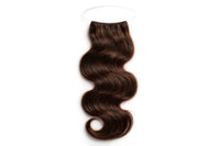 Wavy halo hair extension with dark brown loose wave strands