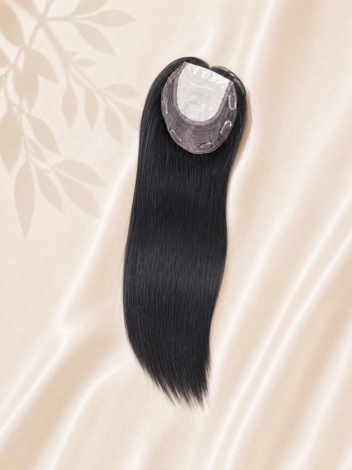 Silk Base medical hair topper hairpiece, long dark black strands with circular silk base.