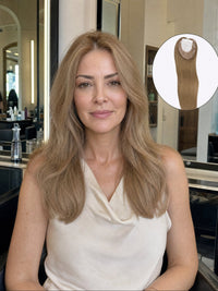 Medium-brown hair topper worn under a sleeveless white top, long layered look