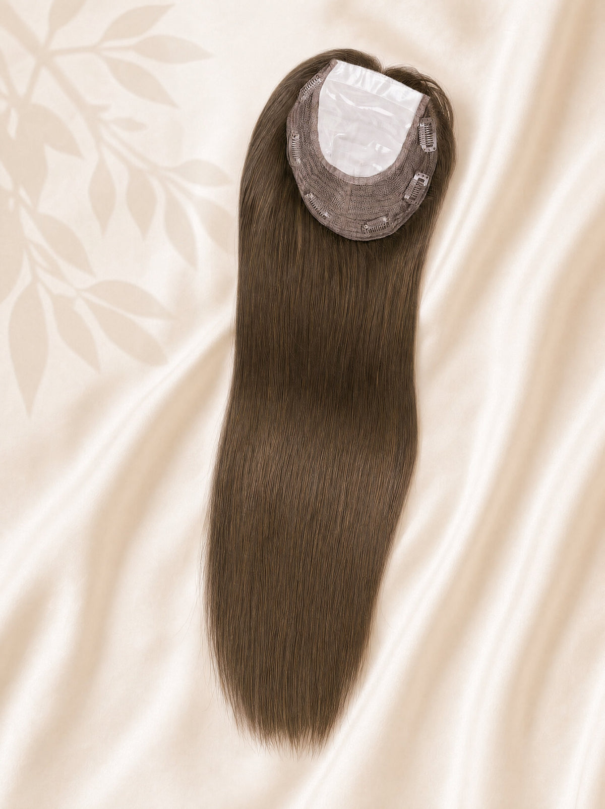 Silk base medical hair topper close-up with medium-brown hair and visible base