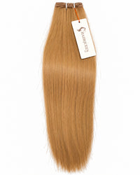 Golden-brown hair weft with straight strands and top stitched closure.