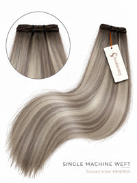 Rooted silver blonde single machine weft with wavy, soft curls