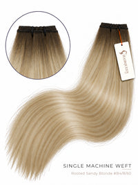 Rooted light blonde single machine weft hair with straight strands