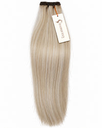 Hair extension weft in light blonde, straight texture with dark weft band.
