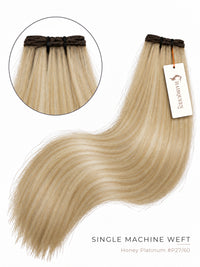 Machine weft hair extension in honey platinum blonde (#27/60), straight with soft waves