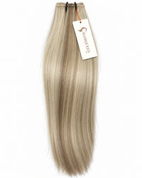 Machine weft hair extension in pale platinum blonde, straight