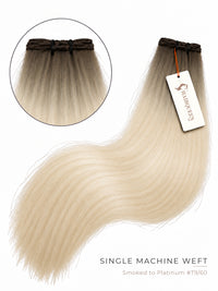 Single machine weft hair extension with dark roots and long smoky platinum blonde lengths