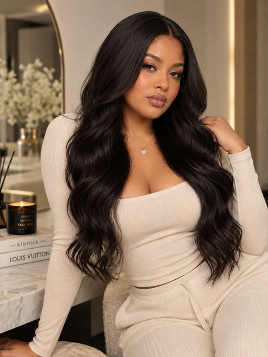 Long dark wavy synthetic wig with side-swept part, loose curls, full volume