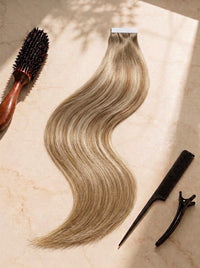 Tape-in hair extensions in light brown, long wavy weft with tape top edge