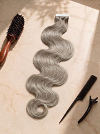 Body wave tape-in extensions, silver-gray wavy hair with tape strip, clips and brush