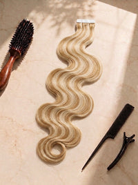 Body wave tape-in extensions, honey blonde wavy hair with tape strip, clips and brush
