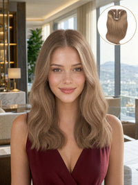 Hair topper worn by model, long light-blonde wavy hair framing the face.