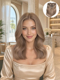 Worn T Hair Topper on model: long wavy medium-brown hair with natural volume.