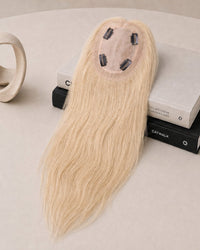 Light blonde hair topper with silk-lace base and visible clip accents