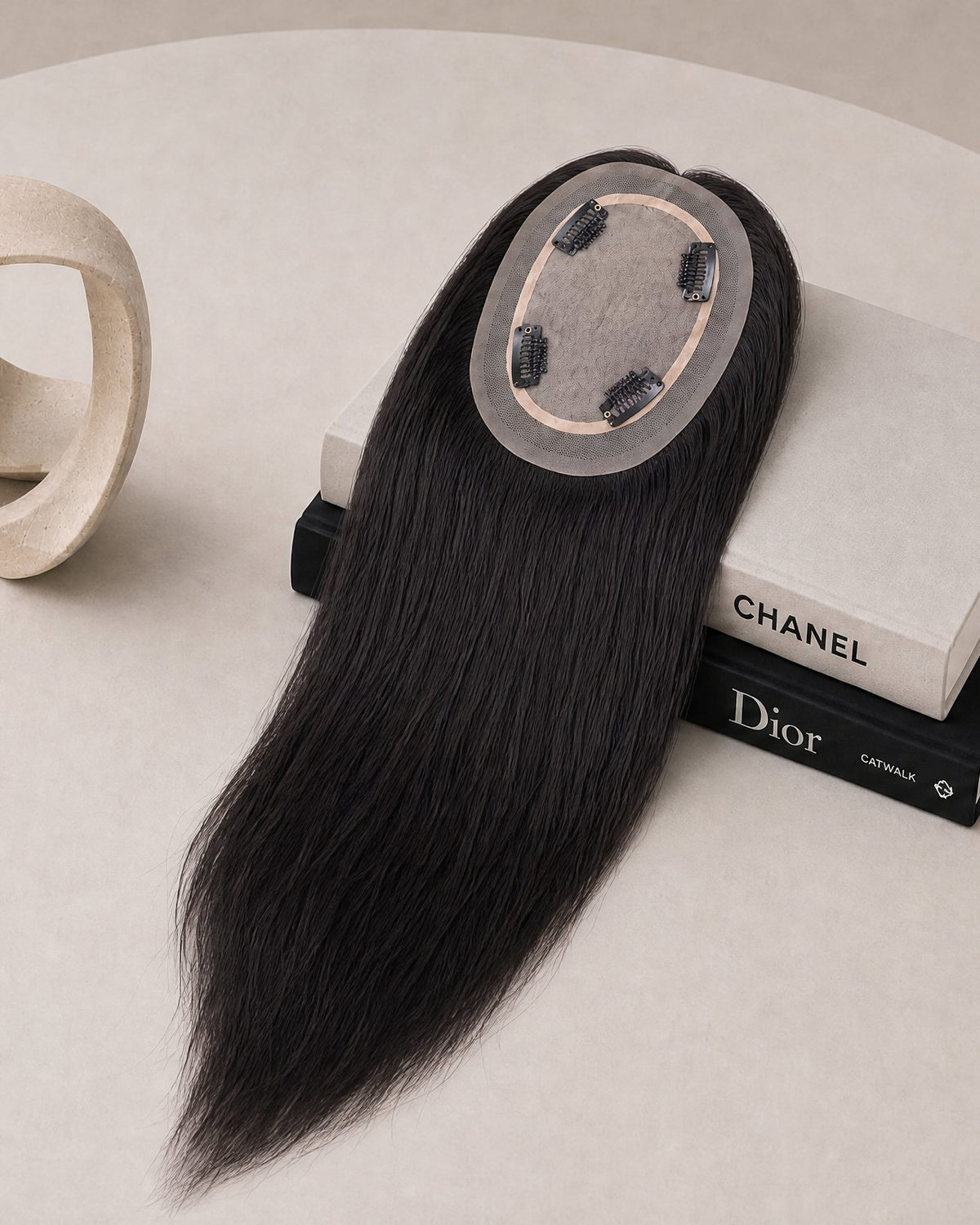 Silk-lace hair topper with long straight dark hair and oval lace base with clips