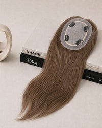 Silk-lace hair topper with long straight medium-brown hair and oval lace base with clips