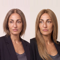 Model wearing long straight blonde hair topper with a side part.