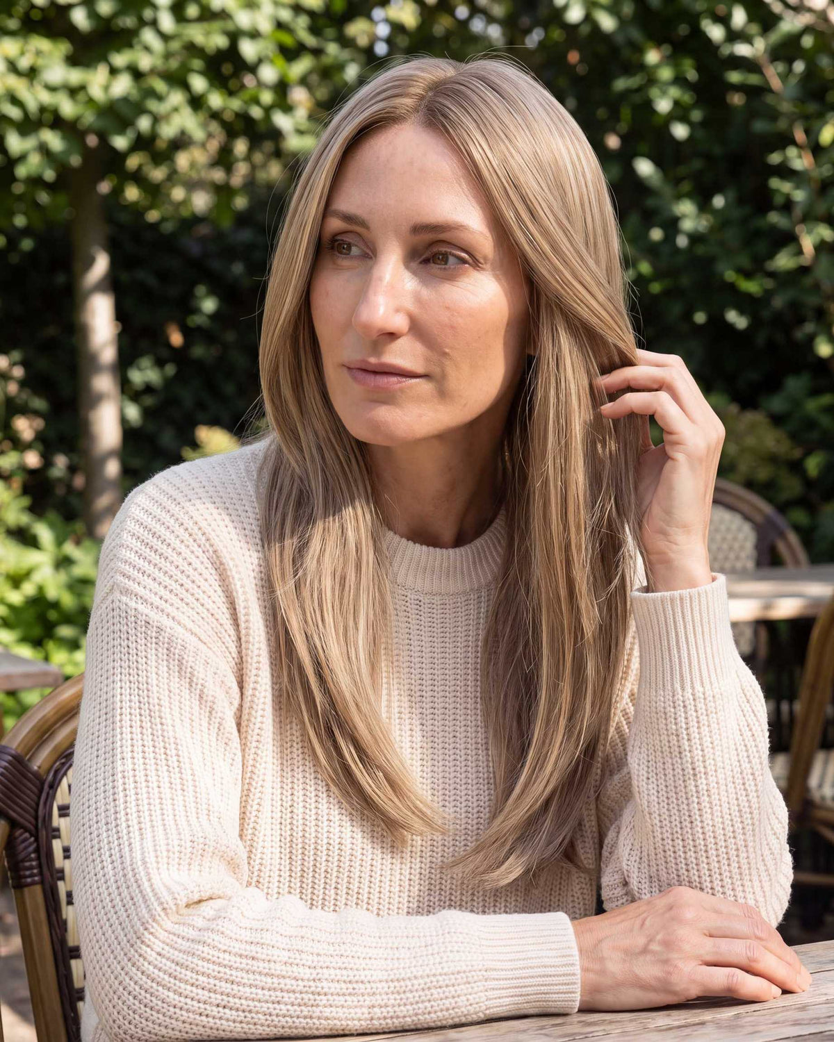 Light blonde hair topper, long straight hair worn with textured knit top