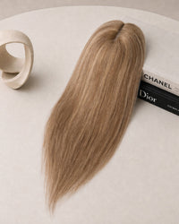 Light blonde hair topper with oval lace cap and long straight coverage.