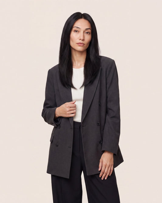 Hair topper with long straight black hair, worn with a side-part look