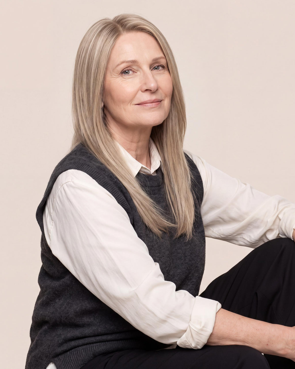 Silicone skin topper with straight ash blonde hair, long length, side part.