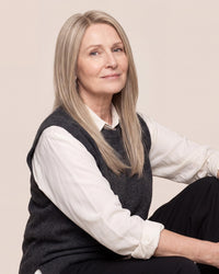 Silicone skin topper with straight ash blonde hair, long length, side part.