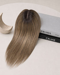 Silicone-skin hair topper with long straight medium-brown hair and subtle highlights