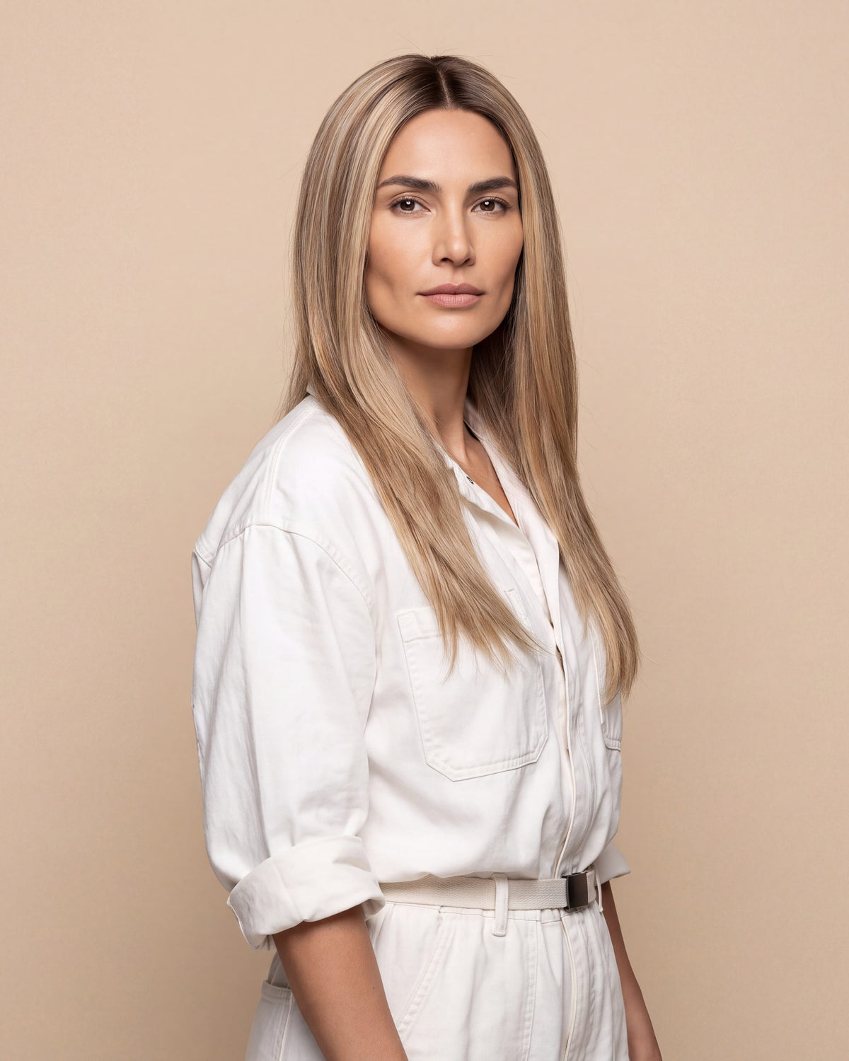 Silicone skin topper with straight long blonde hair, side part, natural-looking strands.
