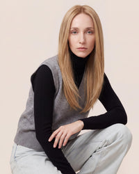 Blonde straight hair topper with thin skin base, center part