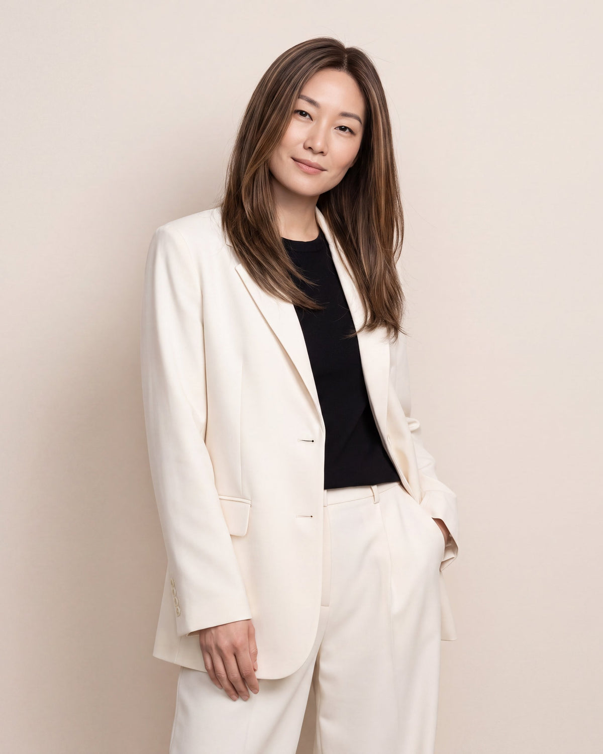 Hair topper with long straight dark brown hair, worn with a side-part look