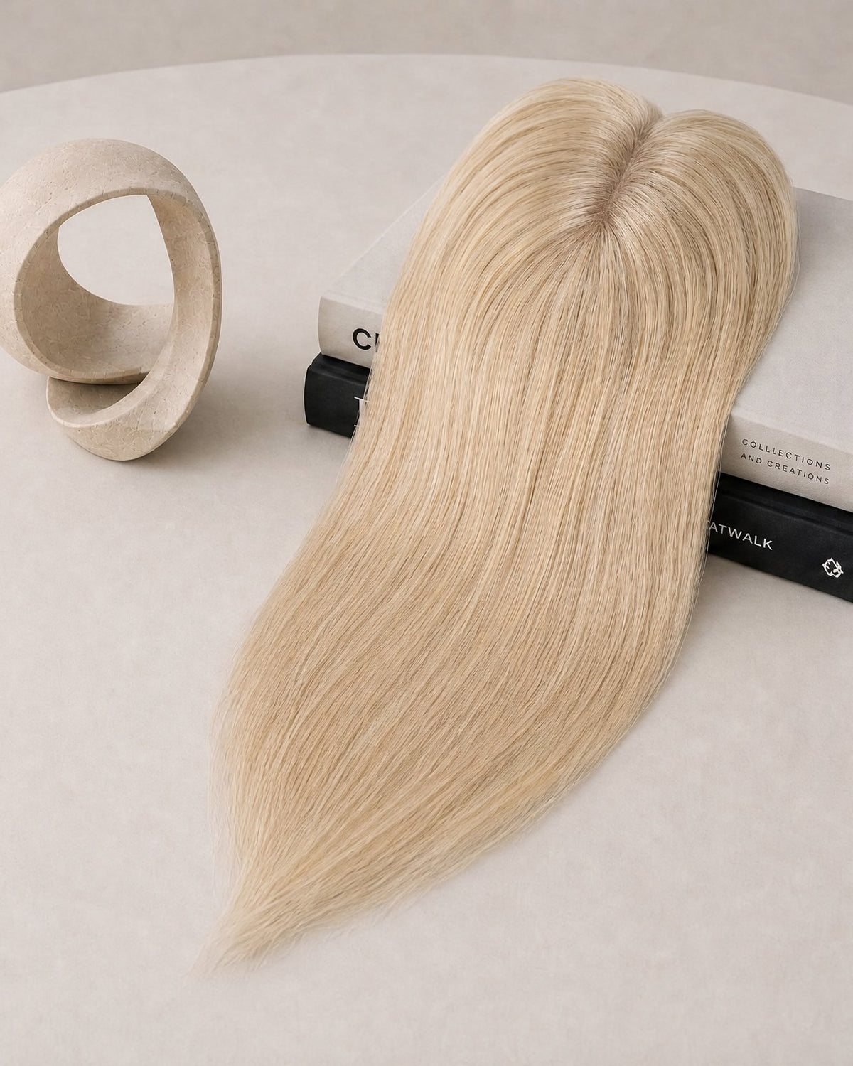 Platinum blonde hair topper with clear base and three fastening clips