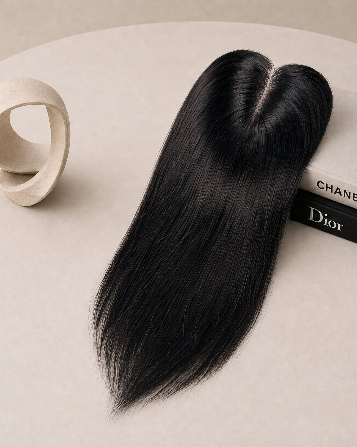 Black hair topper with clear base and three fastening clips