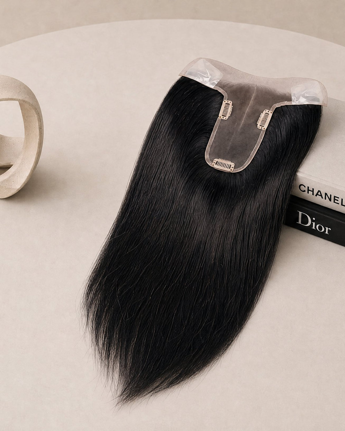 Jet black hair topper with clear base and three fastening clips