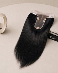 Jet black hair topper with clear base and three fastening clips