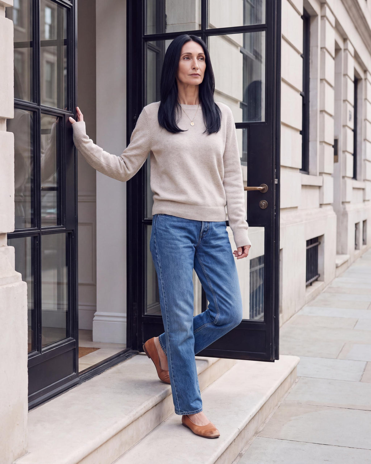 Hairline topper worn by model, long dark hair with smooth front styling