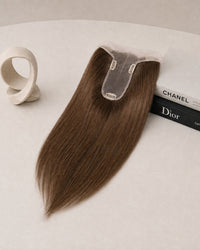 Dark brown hair topper with clear base and three fastening clips