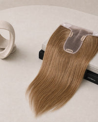 Hairline topper with caramel-brown hair and sheer lace front base with two clips