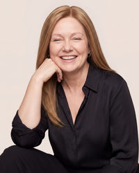 Hairline topper worn by model, long light brown hair with natural part