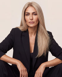 Long blonde hair topper with smooth, straight texture, close-up view