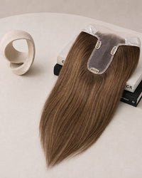 Hairline topper with medium brown, straight hair and lace front base with two clips