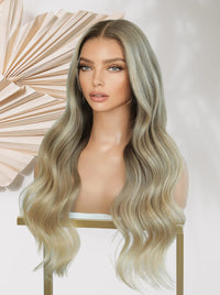 Glueless lace wig with long wavy beige-blonde hair and side-swept part