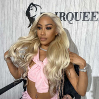 Model wearing long wavy blonde wig with pink bow top for wig install class