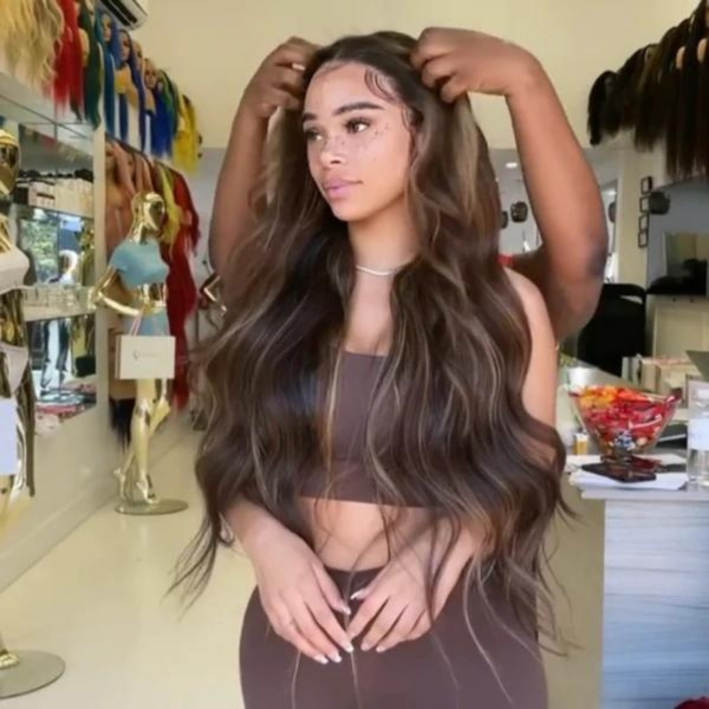 Balayage color class: model with long wavy dark brown hair, center part.